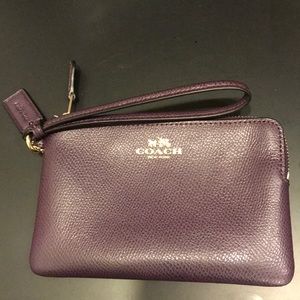 Purple COACH wristlet. BRAND NEW. Never used.
